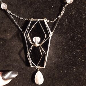 Stained glass spider coffin necklace